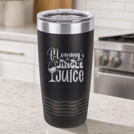 Black 20 oz tumbler laser engraved with "Mommy's Jingle Juice", on a kitchen counter