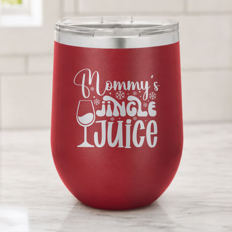 Maroon 12 oz stemless wine tumbler laser engraved with "Mommy's Jingle Juice", on a kitchen counter