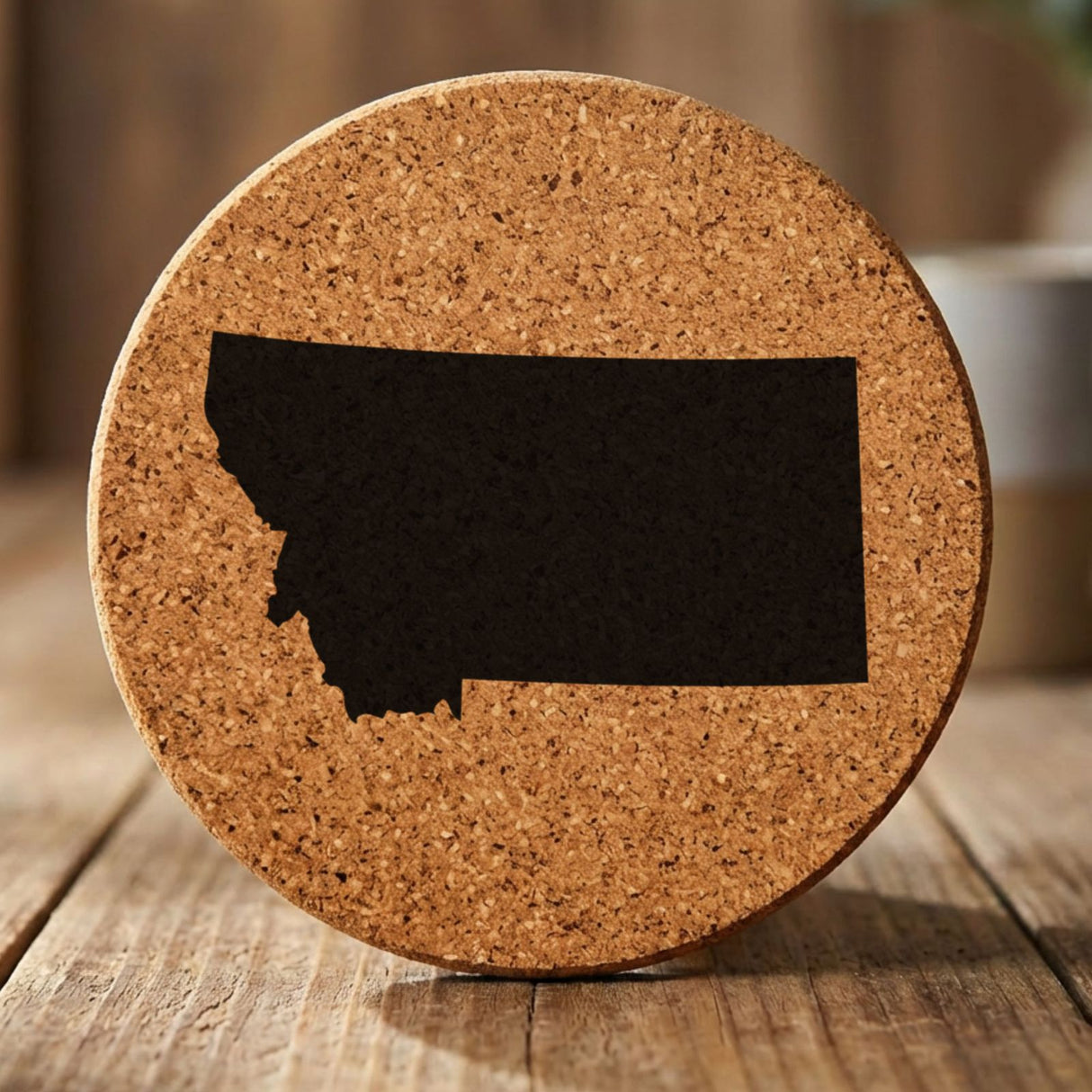 Montana round cork coaster with the full state shape engraved