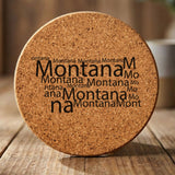 Montana round cork coaster engraved with a word cloud of repeating Montana text