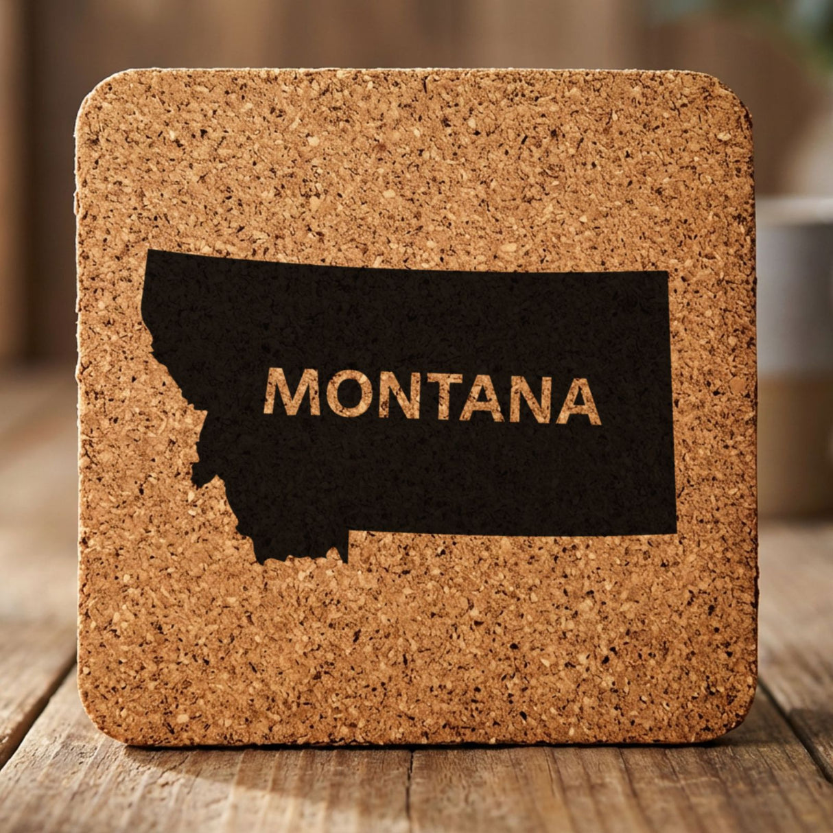 Montana square cork coaster engraved with the state shape and MONTANA in bold lettering