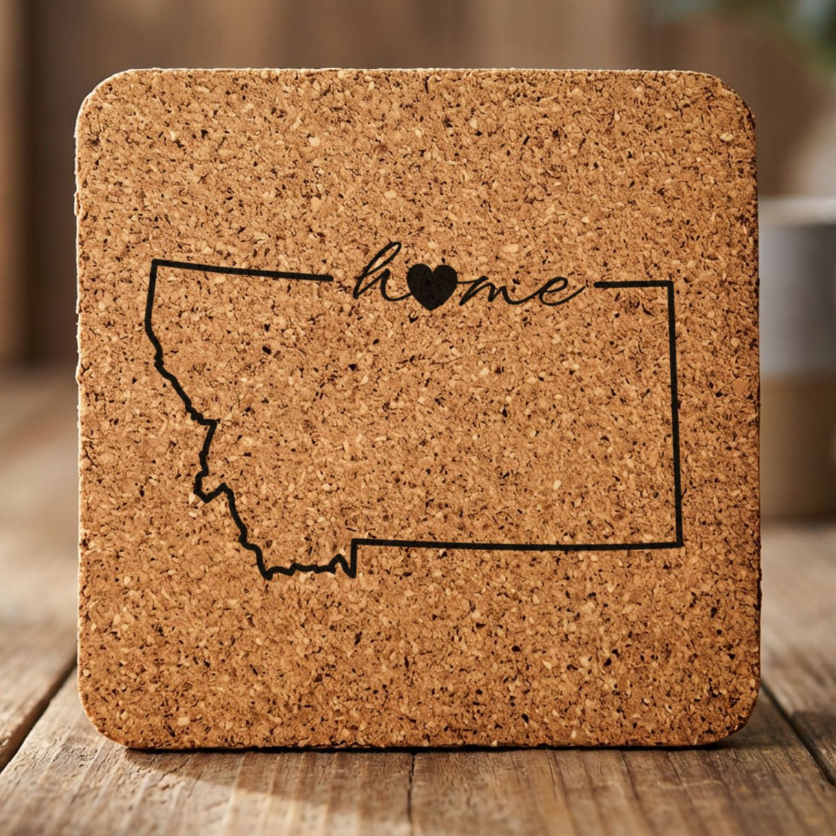 Montana square cork coaster engraved with the state outline and home in script with a heart