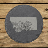 Montana round slate coaster engraved with the state shape in ornate floral scrollwork