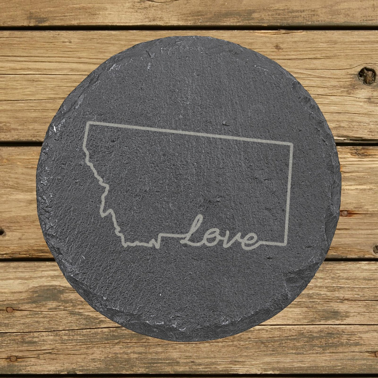 Montana round slate coaster engraved with a hand-drawn state outline and love in cursive