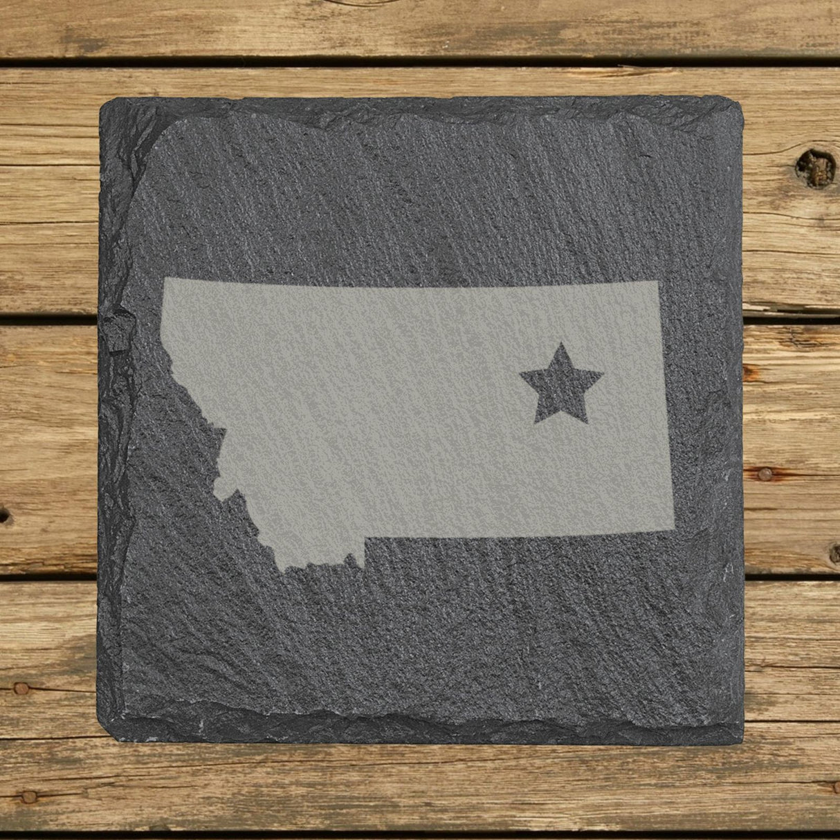 Montana square slate coaster engraved with the state shape and a star