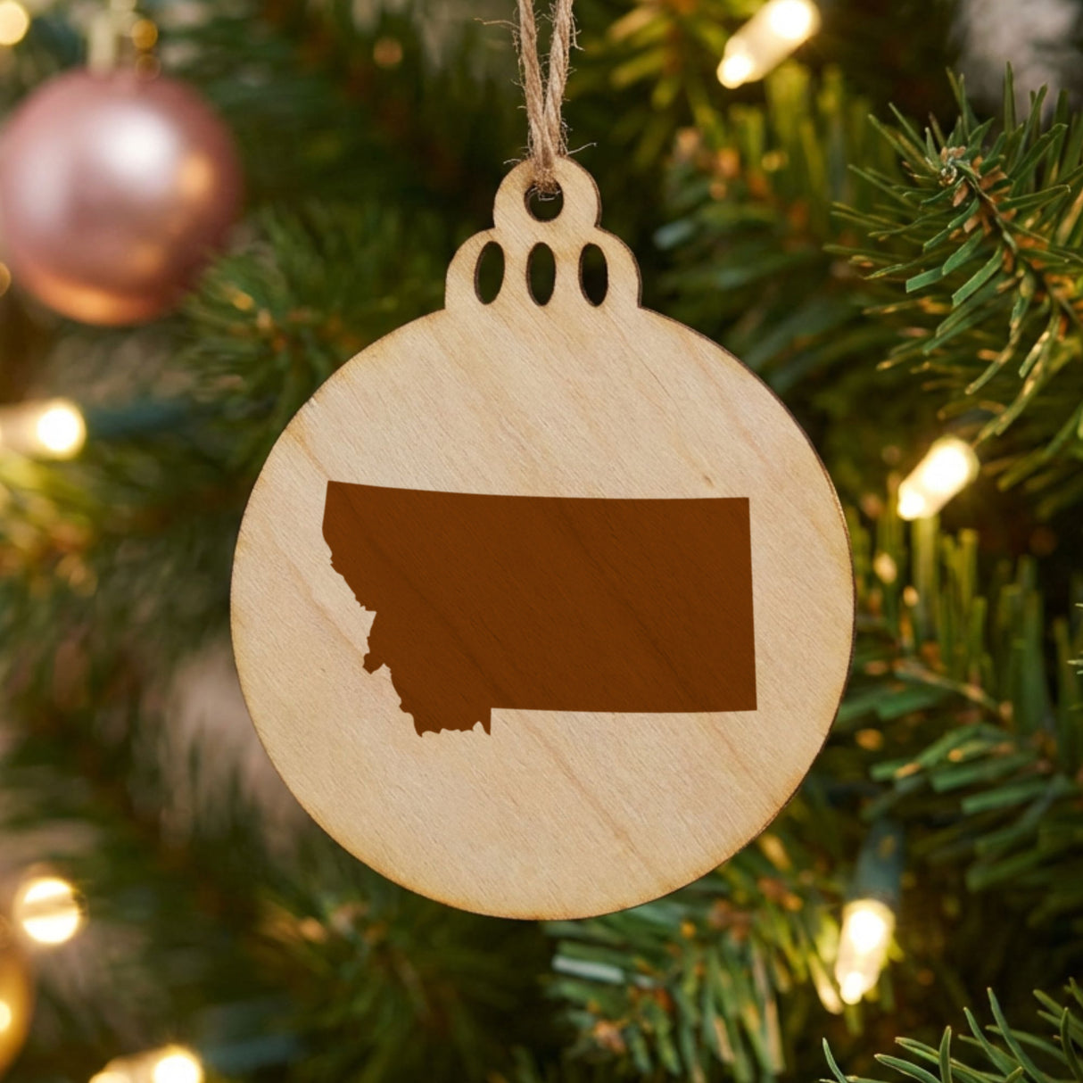 Montana round wood Christmas ornament with the full state shape engraved