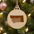 Montana round wood Christmas ornament engraved with the state shape in ornate floral scrollwork