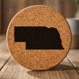 Nebraska round cork coaster with the full state shape engraved