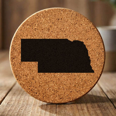 Nebraska round cork coaster with the full state shape engraved