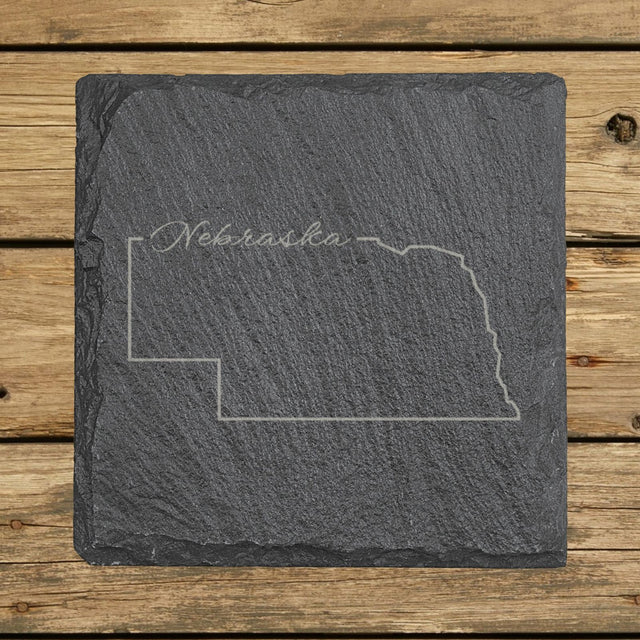 Nebraska square slate coaster engraved with the state outline and Nebraska in script lettering