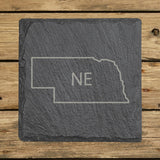 Nebraska square slate coaster engraved with the state outline and NE initials