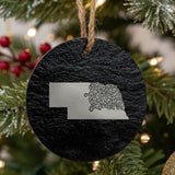 Nebraska round slate Christmas ornament engraved with the state shape in ornate floral scrollwork