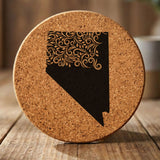 Nevada round cork coaster engraved with the state shape in ornate floral scrollwork