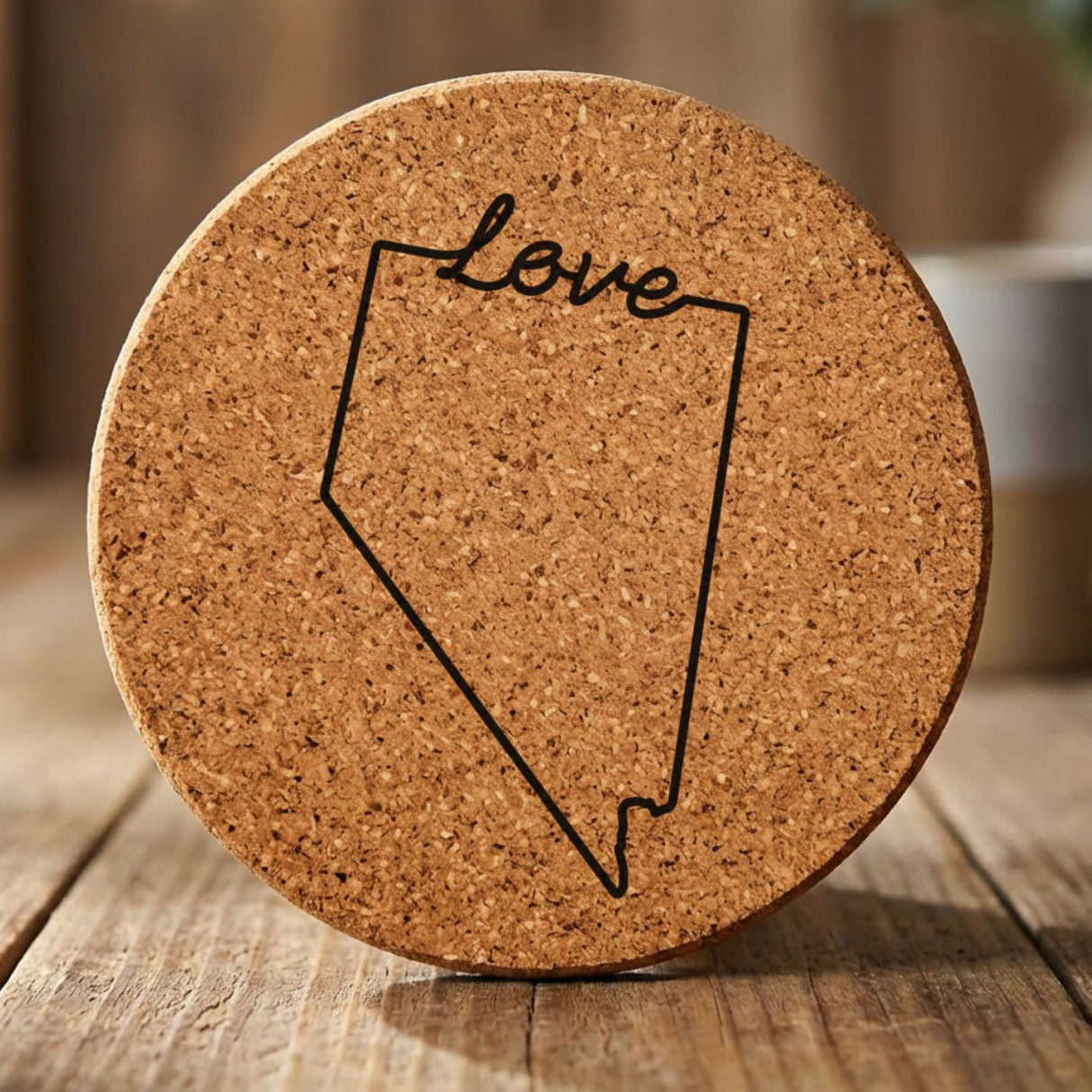 Nevada round cork coaster engraved with a hand-drawn state outline and love in cursive