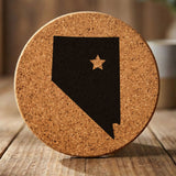 Nevada round cork coaster engraved with the state shape and a star