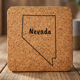 Nevada square cork coaster engraved with the state outline and NEVADA in hand-drawn brush lettering