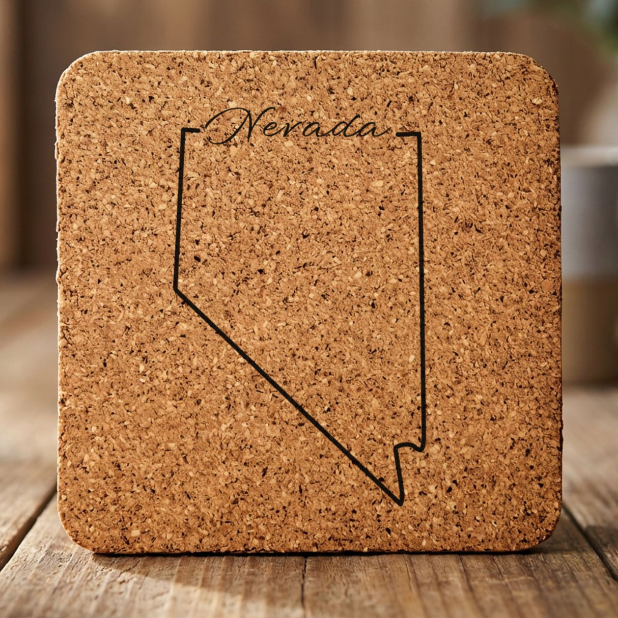 Nevada square cork coaster engraved with the state outline and Nevada in script lettering