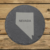 Nevada round slate coaster engraved with the state shape and NEVADA in bold lettering