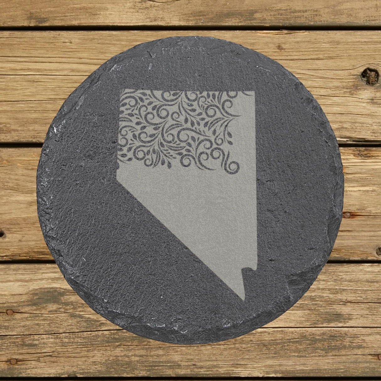 Nevada round slate coaster engraved with the state shape in ornate floral scrollwork