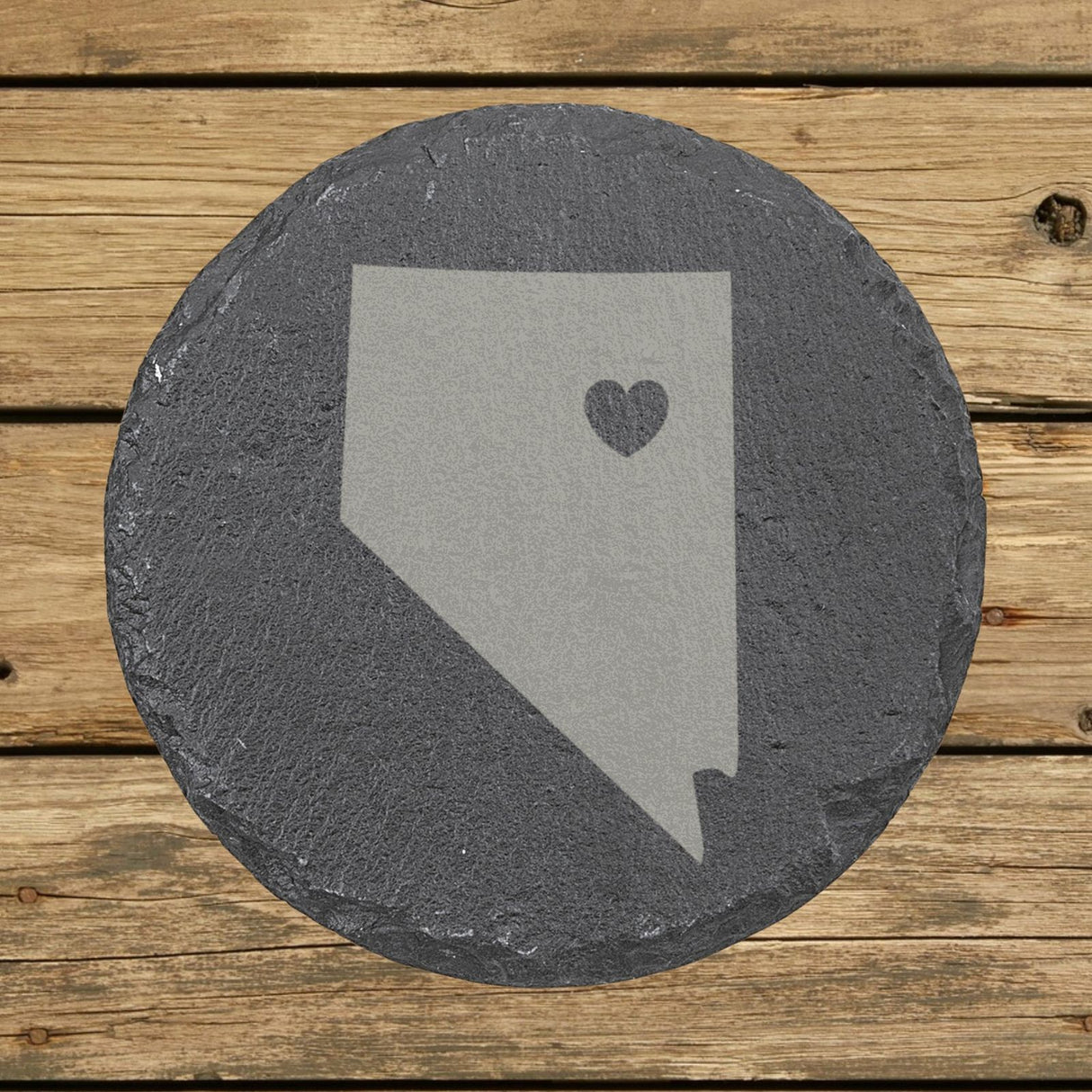 Nevada round slate coaster engraved with the state shape and a heart