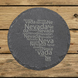 Nevada round slate coaster engraved with a word cloud of repeating Nevada text