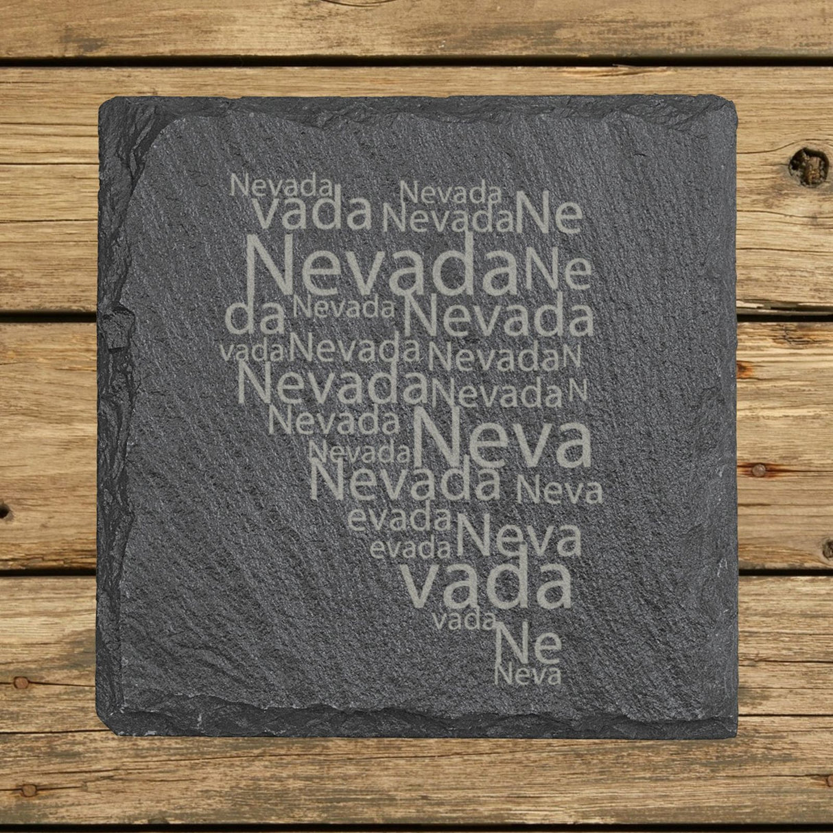 Nevada square slate coaster engraved with a word cloud of repeating Nevada text