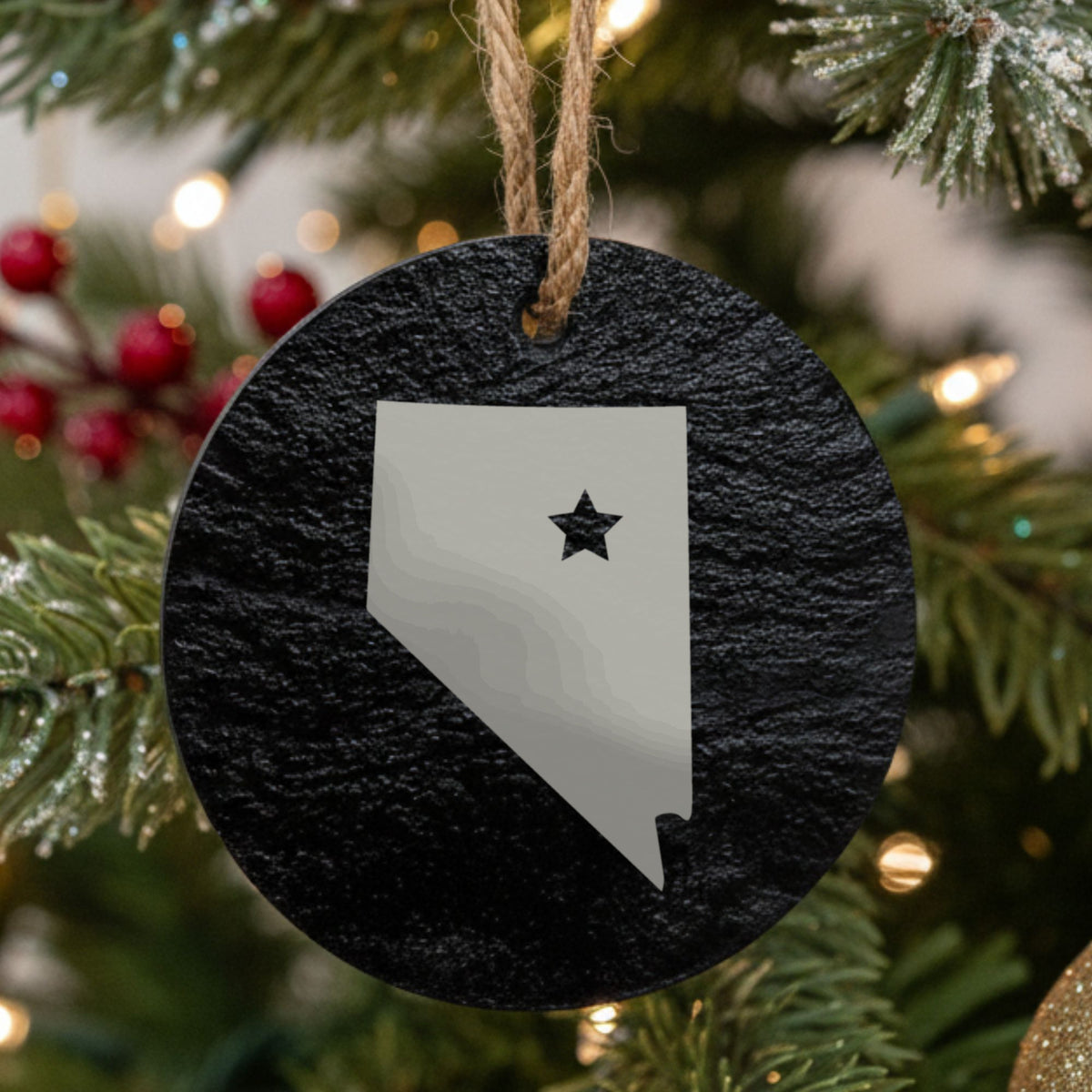 Nevada round slate Christmas ornament engraved with the state shape and a star