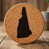 New Hampshire round cork coaster with the full state shape engraved