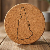 New Hampshire round cork coaster engraved with the state outline and est. 1788