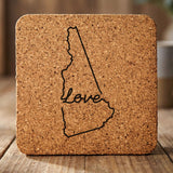 New Hampshire square cork coaster engraved with a hand-drawn state outline and love in cursive
