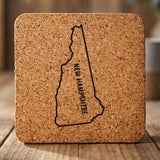 New Hampshire square cork coaster engraved with the state outline and NEW HAMPSHIRE running vertically