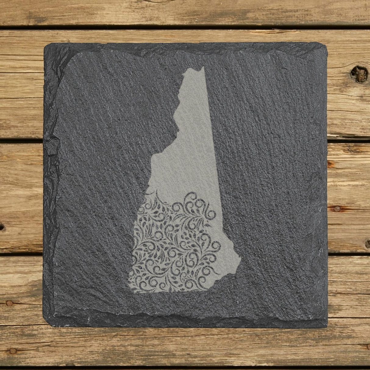 New Hampshire square slate coaster engraved with the state shape in ornate floral scrollwork
