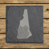 New Hampshire square slate coaster engraved with the state shape in ornate floral scrollwork