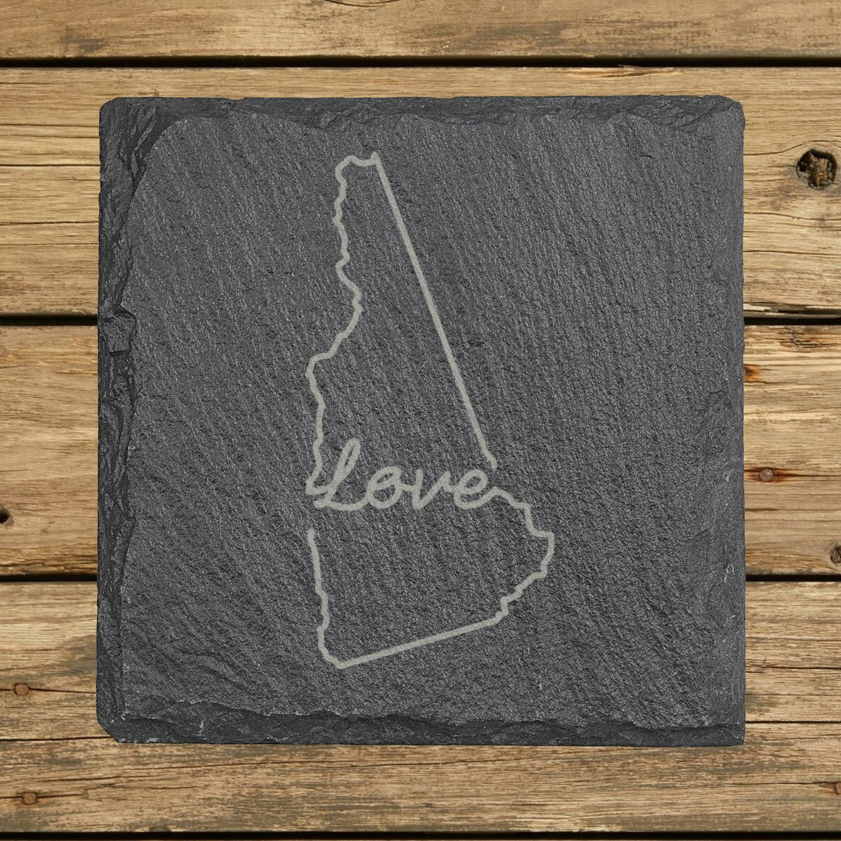 New Hampshire square slate coaster engraved with a hand-drawn state outline and love in cursive
