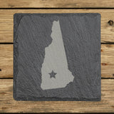 New Hampshire square slate coaster engraved with the state shape and a star