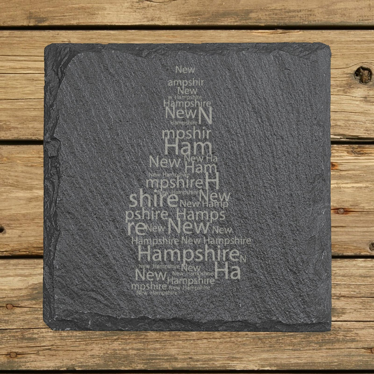 New Hampshire square slate coaster engraved with a word cloud of repeating New Hampshire text