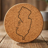 New Jersey round cork coaster engraved with the state outline and est. 1787