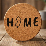 New Jersey round cork coaster engraved with HOME using the state outline as the letter O