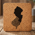 New Jersey square cork coaster engraved with the state shape in ornate floral scrollwork