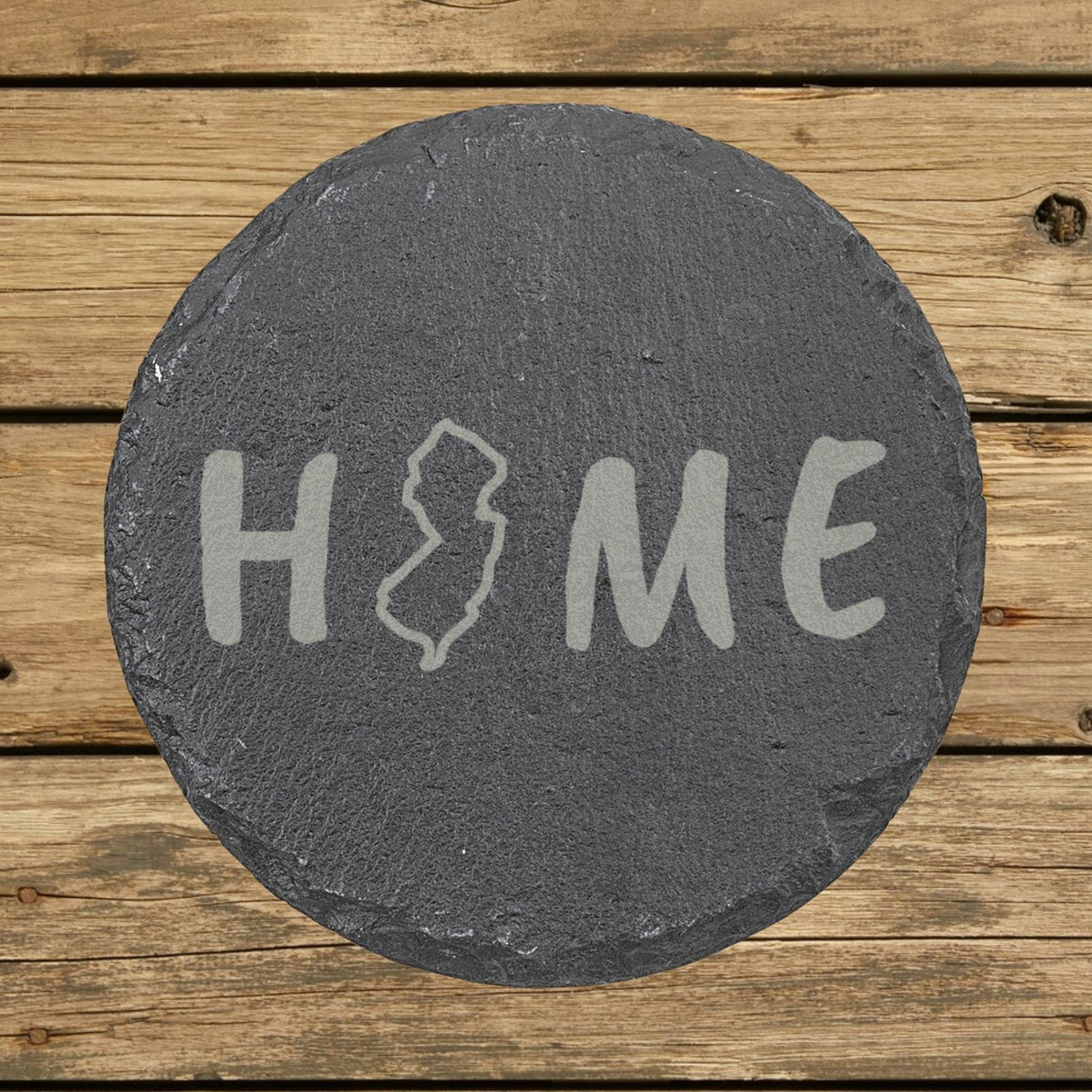 New Jersey round slate coaster engraved with HOME using the state outline as the letter O