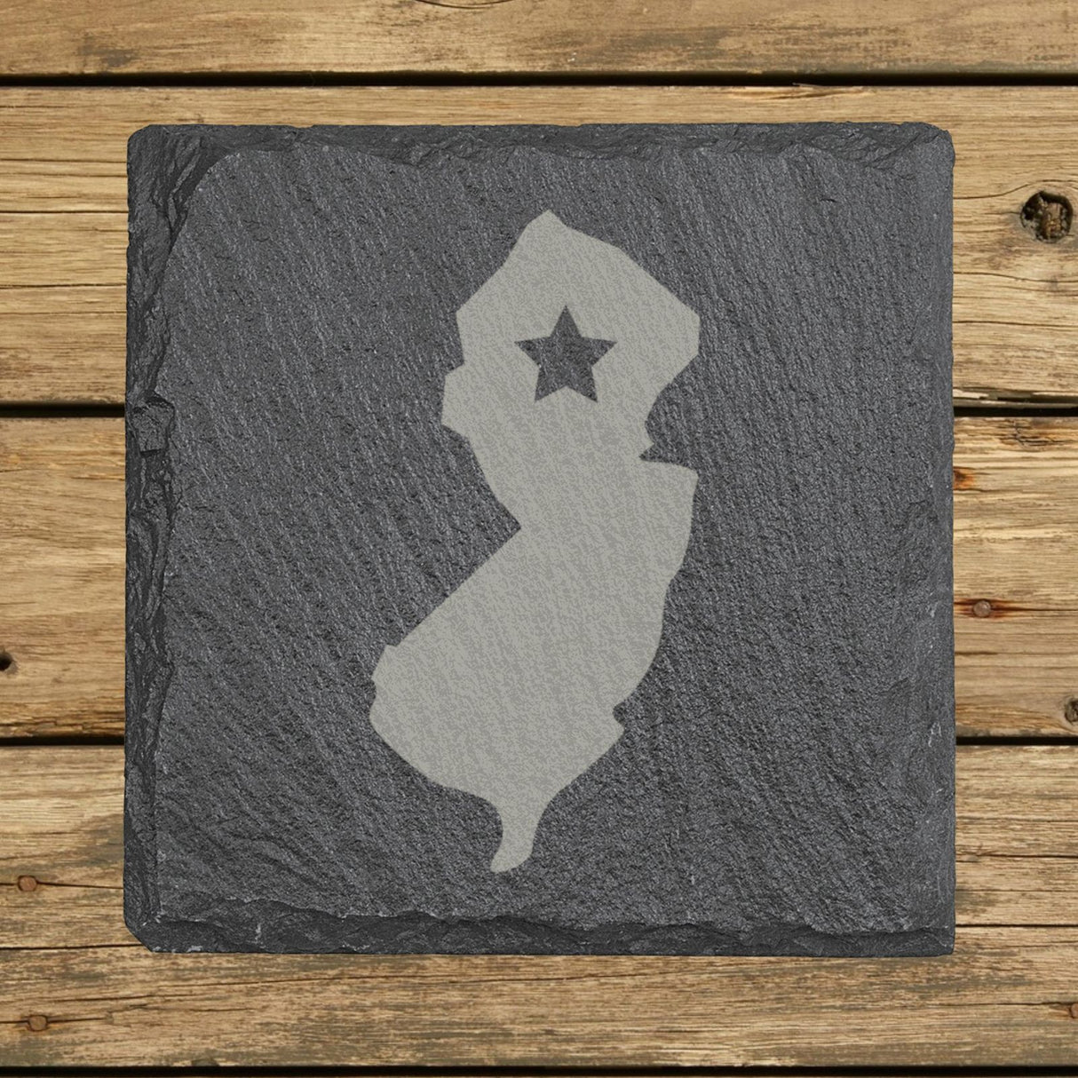 New Jersey square slate coaster engraved with the state shape and a star