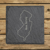 New Jersey square slate coaster engraved with the state outline and NEW JERSEY running vertically