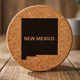 New Mexico round cork coaster engraved with the state shape and NEW MEXICO in bold lettering