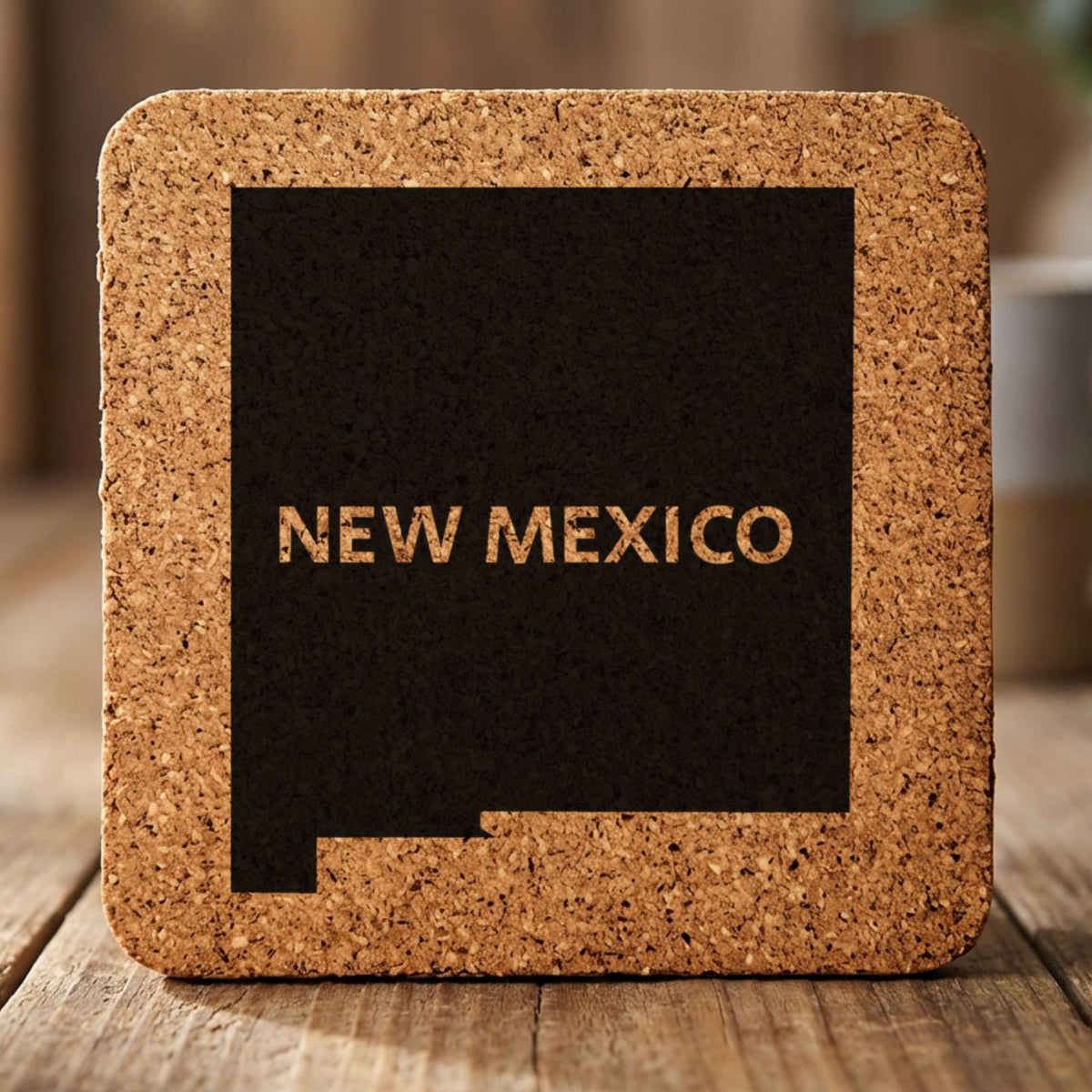 New Mexico square cork coaster engraved with the state shape and NEW MEXICO in bold lettering