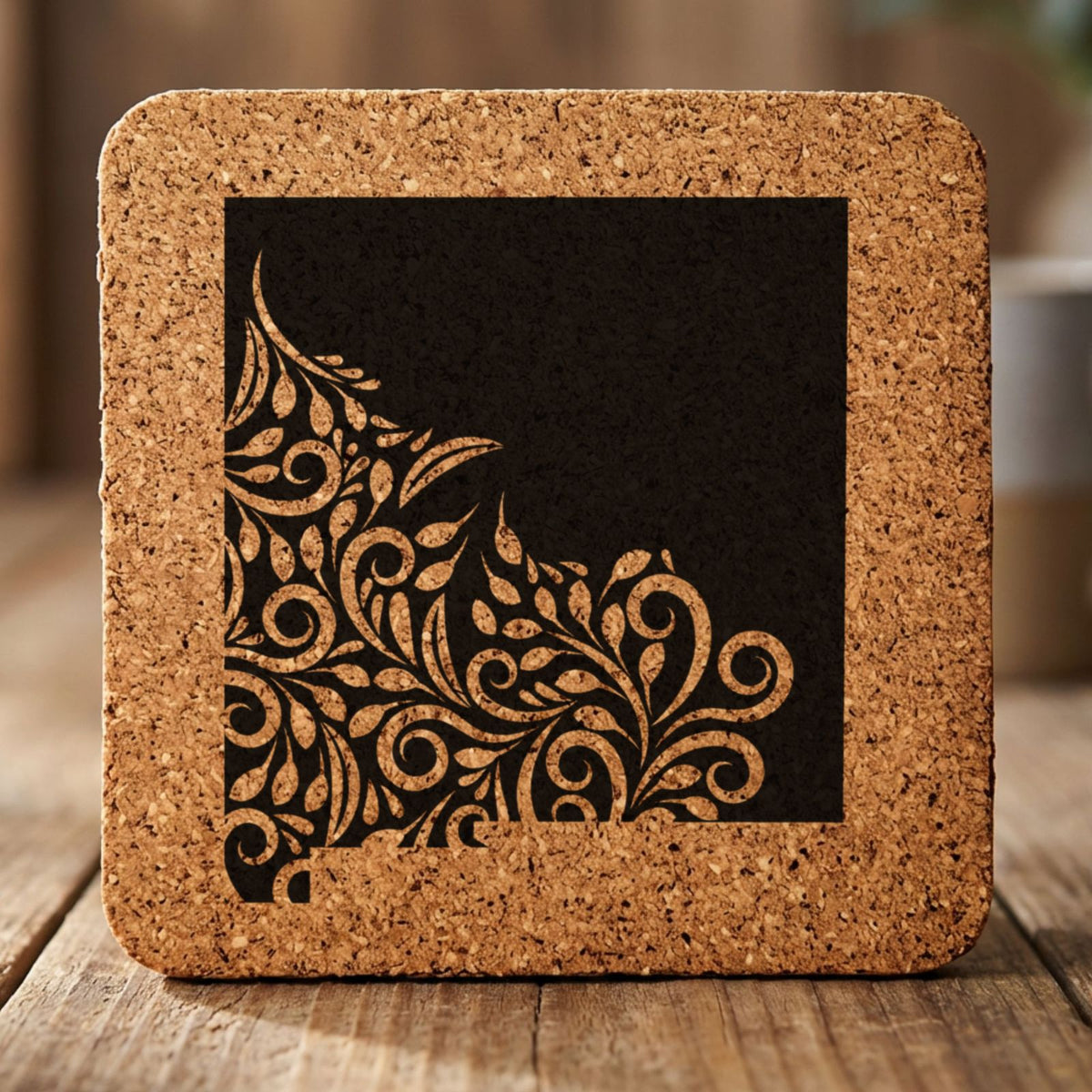 New Mexico square cork coaster engraved with the state shape in ornate floral scrollwork