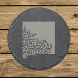 New Mexico round slate coaster engraved with the state shape in ornate floral scrollwork