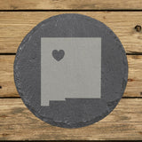 New Mexico round slate coaster engraved with the state shape and a heart