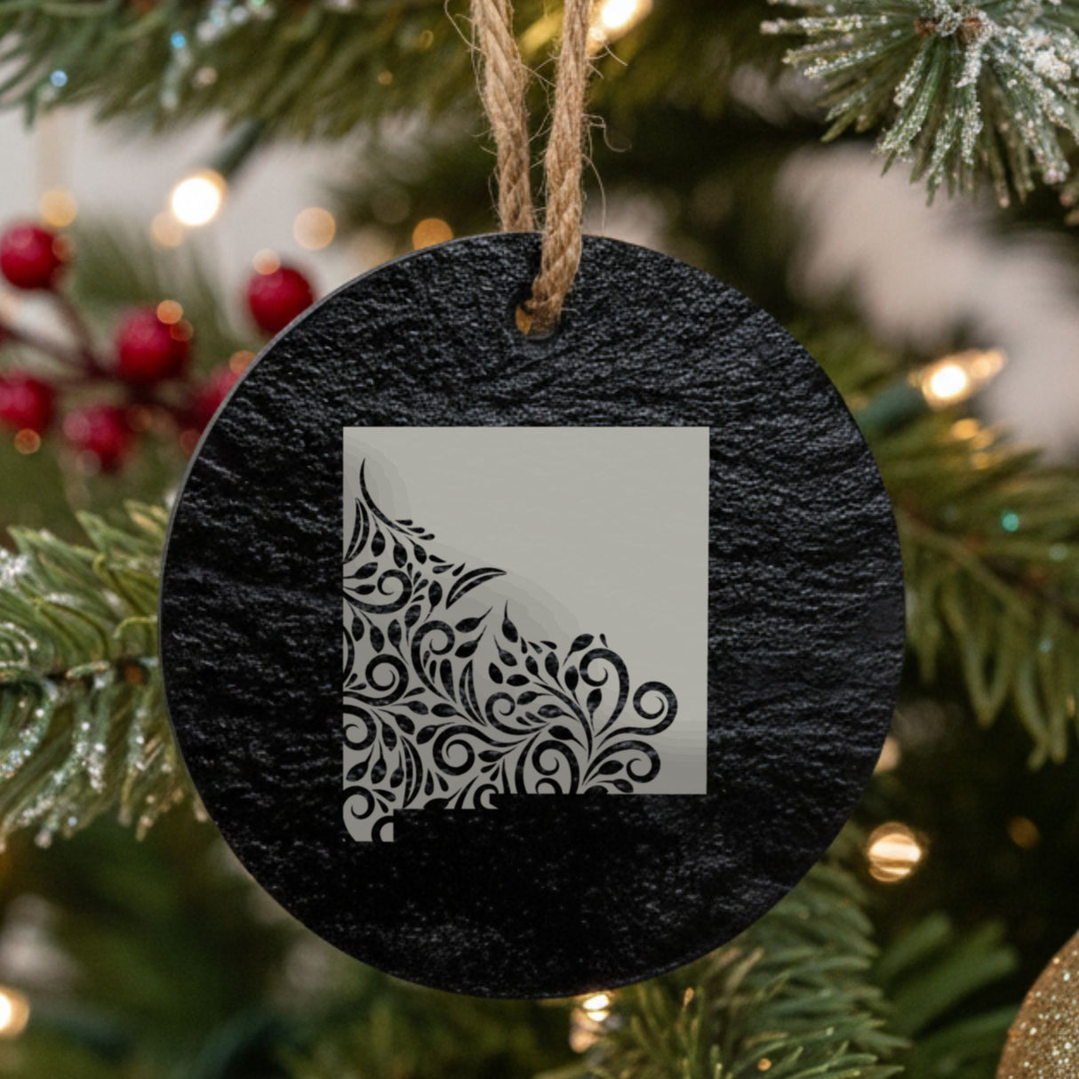 New Mexico round slate Christmas ornament engraved with the state shape in ornate floral scrollwork