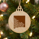 New Mexico round wood Christmas ornament engraved with the state shape in ornate floral scrollwork