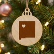 New Mexico round wood Christmas ornament engraved with the state shape and a heart